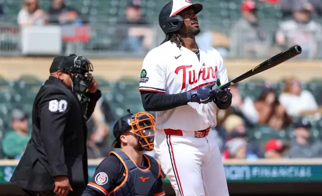 Minnesota Twins' Josh Bell watches his a solo home run during the fourth inning of baseball game against the Detroit Tigers , Thursday, April 9, 2026, in Minneapolis. (AP Photo/Matt Krohn)