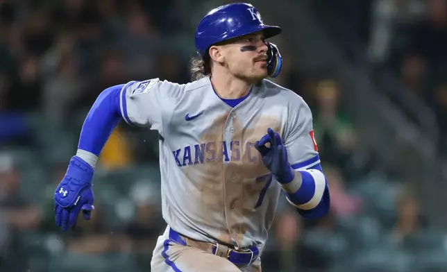 Kansas City Royals' Bobby Witt Jr. watches his three run home run during the 10th inning of a baseball game against the Athletics, Tuesday, April 28, 2026, in West Sacramento, Calif. (AP Photo/Scott Marshall)