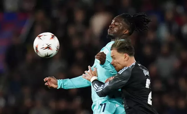 Bologna's Jonathan Rowe, left, and Aston Villa's Matty Cash in action during the Europa League soccer match between Bologna and Aston Villa in Bologna, Italy, Thursday April 9, 2026. (Massimo Paolone/LaPresse via AP)