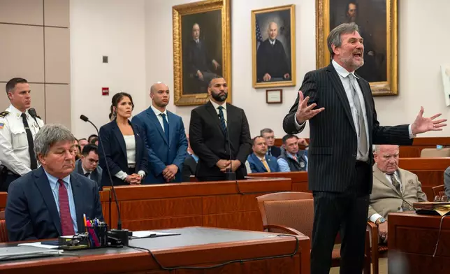 Lawyer Bradford Bailey, right, speaks as Lt. Jennifer Penton, center, from left, and troopers David Montanez and Edwin Rodriguez, are arraigned on charges of involuntary manslaughter in the death of Enrique Delgado-Garcia, in Worcester Superior Court, Thursday, April 2, 2026, in Worcester, Mass. Special prosecutor David Meier is seated at left. (Rick Cinclair/Worcester Telegram &amp; Gazette via AP, Pool)