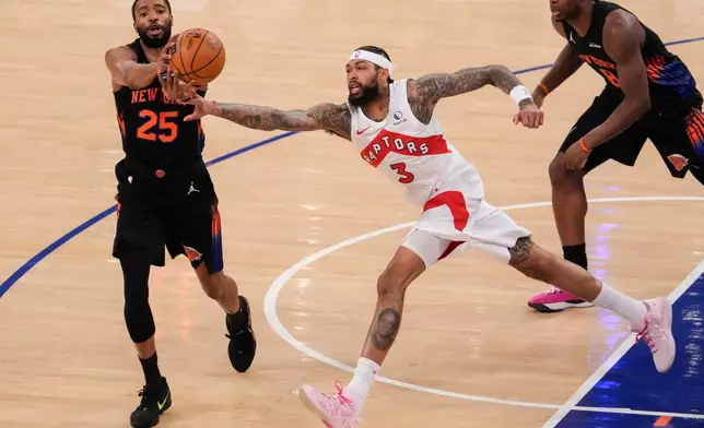 Toronto Raptors forward Brandon Ingram (3) attempts to block New York Knicks guard Mikal Bridges (25) during the first half of an NBA basketball game, Friday, April 10, 2026, in New York. (AP Photo/Yuki Iwamura)