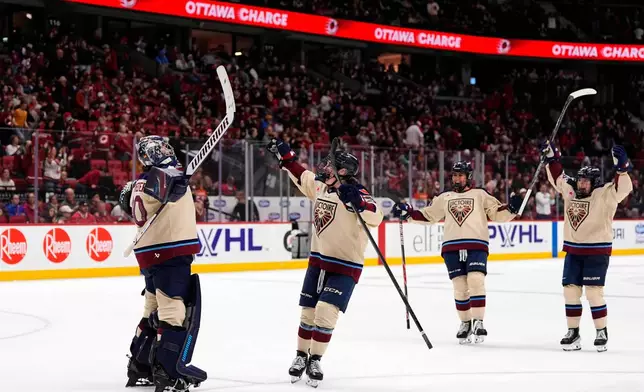 Montreal Victoire goaltender Sandra Abstreiter, left, celebrates after her shutout against the Ottawa Charge in PWHL hockey game action in Ottawa, Ontario, Friday, April 3, 2026. (Justin Tang/The Canadian Press via AP)