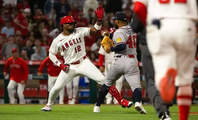 A fight breaks out during the fifth inning of a baseball game between the Los Angeles Angels and the Atlanta Braves, Tuesday, April 7, 2026, in Anaheim, Calif. (AP Photo/Ethan Swope)