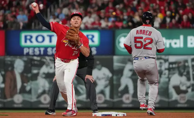 Boston Red Sox's Wilyer Abreu (52) is out at second as St. Louis Cardinals' JJ Wetherholt (26) commits a throwing error trying unsuccessfully to turn the double play allowing a run to score during the fourth inning of a baseball game Friday, April 10, 2026, in St. Louis. (AP Photo/Jeff Roberson)