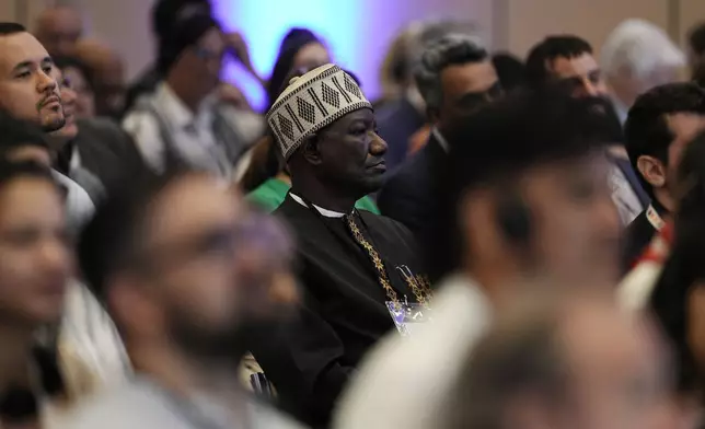 Attendees listen during a plenary session at a conference aimed at transitioning away from fossil fuels Tuesday, April 28, 2026, in Santa Marta, Colombia. (AP Photo/Ivan Valencia)