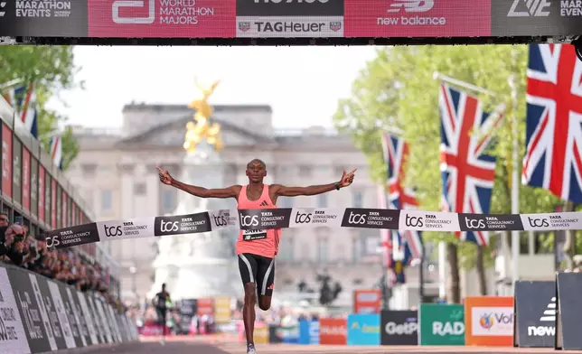 Sebastian Sawe from Kenya crosses the finish line to win the men's race at the London Marathon in London, Sunday, April 26, 2026.(AP Photo/Ian Walton)