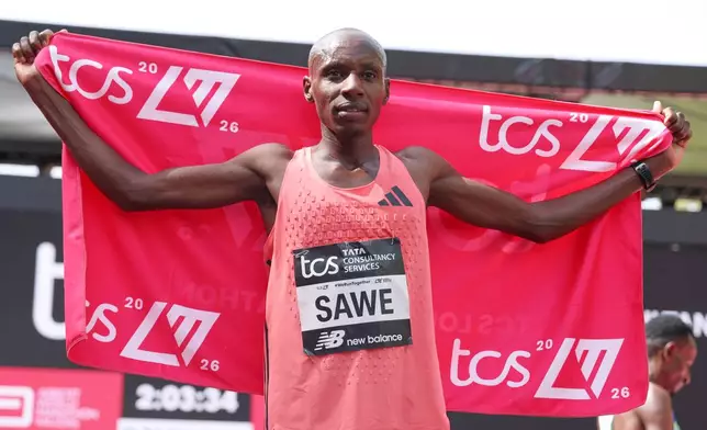 Sebastian Sawe from Kenya celebrates winning the men's race at the London Marathon in London, Sunday, April 26, 2026.(AP Photo/Ian Walton)