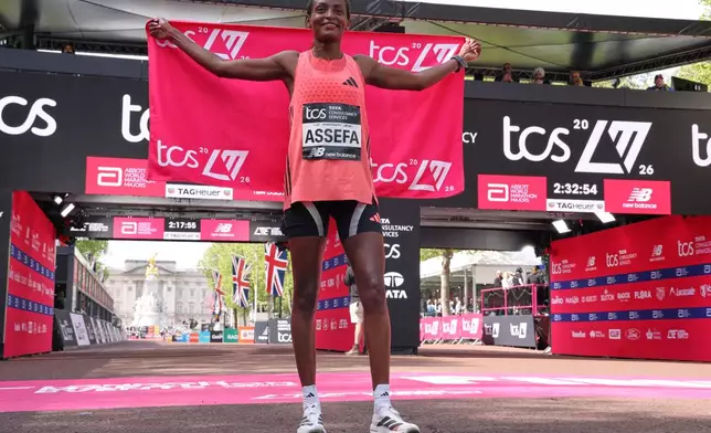 Tigst Assefa of Ethiopia celebrates winning the women race at the London Marathon in London, Sunday, April 26, 2026.(AP Photo/Ian Walton)
