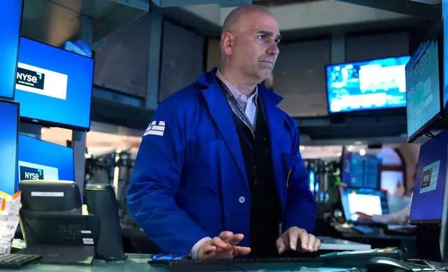Philip Finale works on the floor at the New York Stock Exchange in New York, Tuesday, March 31, 2026. (AP Photo/Seth Wenig)