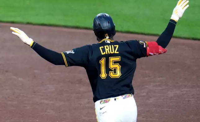Pittsburgh Pirates' Oneil Cruz celebrates as he rounds the bases after hitting a solo home run off pitcher Kyle Leahy during the sixth inning of a baseball game in Pittsburgh, Thursday, April 28, 2026. (AP Photo/Gene J. Puskar)