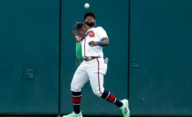 Atlanta Braves center fielder Michael Harris II (23) catches a fly ball hit by Detroit Tigers' Kevin McGonigle (7) during the first inning of a baseball game, Tuesday, April 28, 2026, in Atlanta. (AP Photo/Erik S. Lesser)