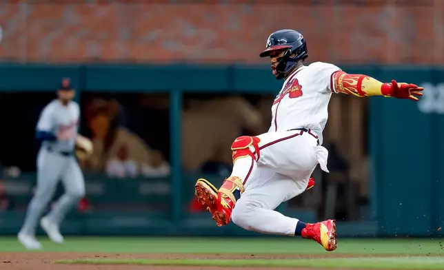 Atlanta Braves' Ronald Acuna Jr. (13) slides in safe at second base with a leadoff double against the Detroit Tigers during the first inning of a baseball game, Tuesday, April 28, 2026, in Atlanta. (AP Photo/Erik S. Lesser)