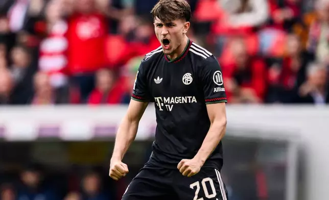 Bayern's Tom Bischof celebrates after scoring during the German Bundesliga soccer match between SC Freiburg and Bayern Munich in Freiburg im Breisgau, Germany, Saturday, April 4, 2026. (Tom Weller/dpa via AP)