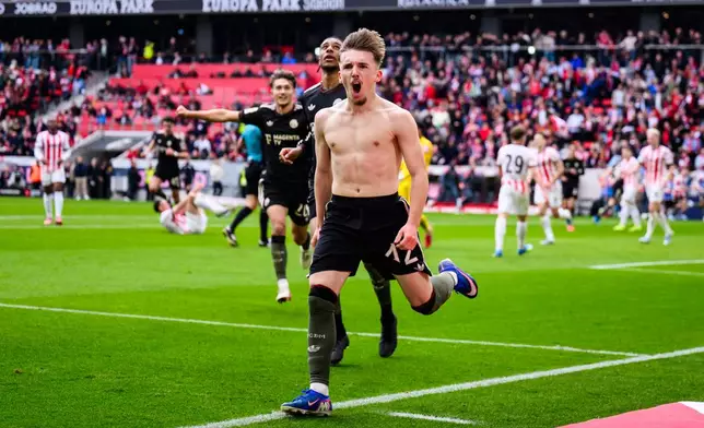 Bayern's Lennart Karl celebrates after scoring during the German Bundesliga soccer match between SC Freiburg and Bayern Munich in Freiburg im Breisgau, Germany, Saturday, April 4, 2026. (Tom Weller/dpa via AP)
