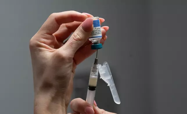 Lauren Ellenburg, a nurse, prepares a combination measles, mumps and rubella vaccine for a 12-month-old at Tiger Pediatrics in Easley, S.C., on March 17, 2026. (AP Photo/Mary Conlon)