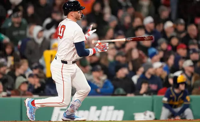 Boston Red Sox shortstop Trevor Story hits a two-run double win the sixth inning of a baseball game against the Milwaukee Brewers Tuesday, April 7, 2026, in Boston. (AP Photo/Robert F. Bukaty)