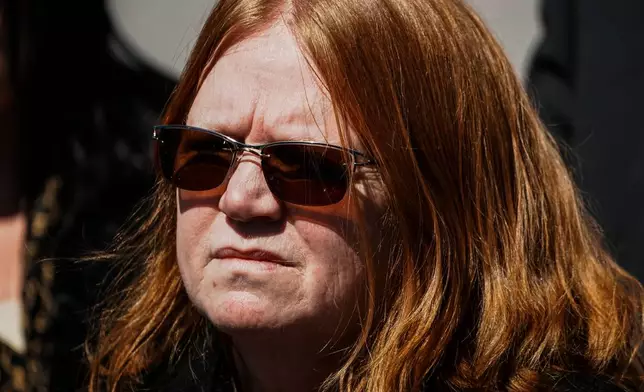 Asa Ellerup, wife, of Rex Heuermann waits to give her statement outside the courthouse as Rex Heuermann, accused in Long Island's infamous Gilgo Beach serial killings, pleaded guilty on Wednesday, April 8, 2026, at Suffolk County Court in Riverhead, New York. (AP Photo/Eduardo Munoz Alvarez)