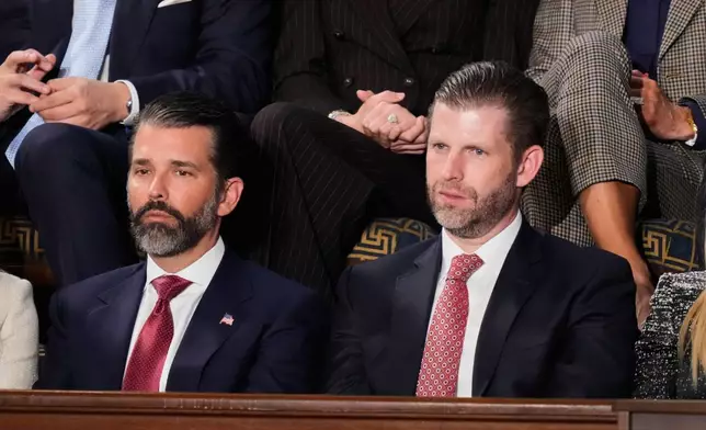 FILE - Donald Trump Jr. and Eric Trump listen to President Donald Trump's State of the Union address to a joint session of Congress in the House chamber at the U.S. Capitol in Washington, Tuesday, Feb. 24, 2026. (AP Photo/Alex Brandon, File)