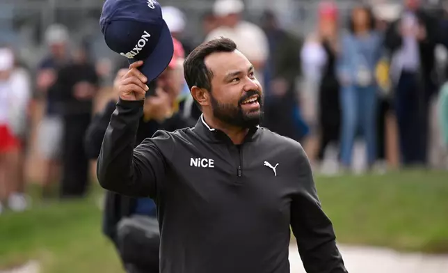 J.J. Spaun waves to fans after winning the Valero Texas Open golf tournament in San Antonio, Sunday, April 5, 2026. (AP Photo/Darren Abate)