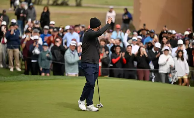 J.J. Spaun waves to fans on the 18th hole after the fourth round of the Valero Texas Open golf tournament in San Antonio, Sunday, April 5, 2026. (AP Photo/Darren Abate)