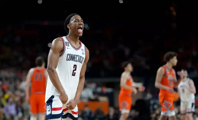 UConn guard Silas Demary Jr. celebrates after the second half of an NCAA college basketball tournament semifinal game against Illinois at the Final Four, Saturday, April 4, 2026, in Indianapolis. (AP Photo/Abbie Parr)