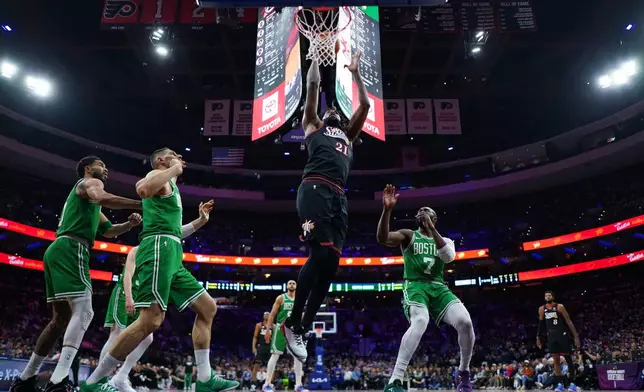 Philadelphia 76ers' Joel Embiid (21) goes up for a shot during the first half of Game 4 against the Boston Celtics in a first-round NBA basketball playoffs series Sunday, April 26, 2026, in Philadelphia. (AP Photo/Matt Slocum)