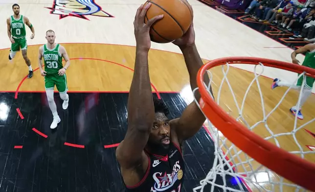 Philadelphia 76ers' Joel Embiid goes up for a dunk during the first half of Game 4 against the Boston Celtics in a first-round NBA basketball playoffs series Sunday, April 26, 2026, in Philadelphia. (AP Photo/Matt Slocum)