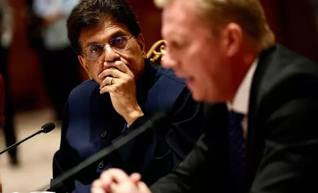 Indian Commerce Minister Piyush Goyal listens as New Zealand Trade Minister Todd McClay delivers his speech during the India New Zealand Free Trade Agreement signing ceremony and Business forum meeting in New Delhi, India, Monday, April 27, 2026. ( AP Photo/Manish Swarup)