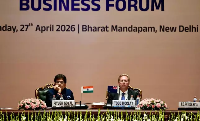 New Zealand Trade Minister Todd McClay, right, sits next to Indian Commerce Minister Piyush Goyal during the India New Zealand Free Trade Agreement signing ceremony and Business forum meeting in New Delhi, India, Monday, April 27, 2026. ( AP Photo/Manish Swarup)