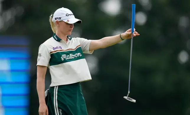 Charley Hull, of England, lines up a putt on the 18th hole during the second round of the Chevron Championship LPGA golf tournament Friday, April 24, 2026, in Houston. (AP Photo/Ashley Landis)