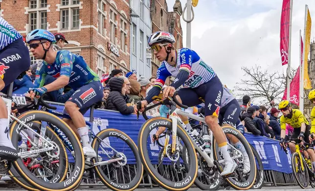 Remco Evenepoel of the Team Red Bull - Bora - Hansgrohe, right, competes during the Tour of Flanders in Oudenaarde, Belgium on Sunday, April 5, 2026. (AP Photo/Geert Vanden Wijngaert)