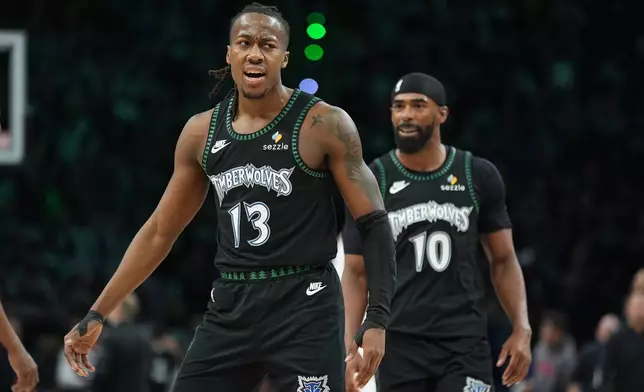Minnesota Timberwolves guard Ayo Dosunmu (13) celebrates after making a 3-point basket during the second half of Game 4 of a first-round NBA basketball playoff series against the Denver Nuggets, Saturday, April 25, 2026, in Minneapolis. (AP Photo/Abbie Parr)