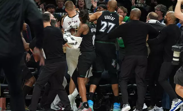 Minnesota Timberwolves and Denver Nuggets players get into an altercation during the second half of Game 4 of a first-round NBA basketball playoff series, Saturday, April 25, 2026, in Minneapolis. (AP Photo/Abbie Parr)