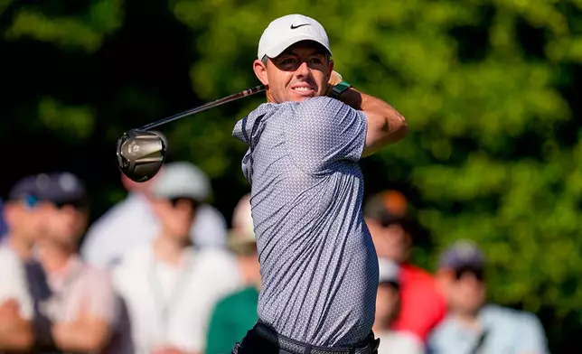 Rory McIlroy, of Northern Ireland, watches his tee shot on the 11th hole during the third round of the Masters golf tournament at the Augusta National Golf Club, Saturday, April 11, 2026, in Augusta, Ga. (AP Photo/David J. Phillip)