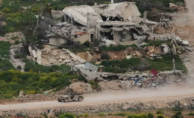 Israeli soldiers drive through southern Lebanon, as seen from northern Israel, Wednesday, April 15, 2026. (AP Photo/Ariel Schalit)