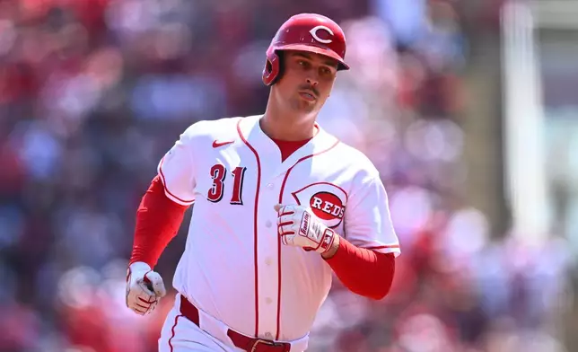 Cincinnati Reds' Nathaniel Lowe runs the bases after hitting a solo home run during the second inning of a baseball game against the Detroit Tigers in Cincinnati, Sunday, April 26, 2026. (AP Photo/Ben Jackson)