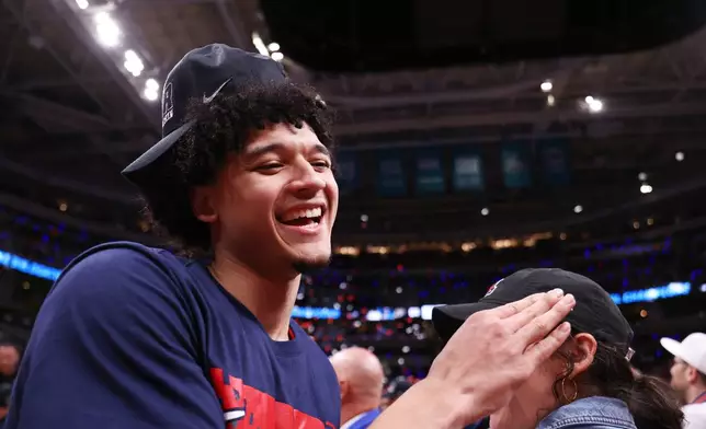 Arizona guard Brayden Burries smiles after a win over Purdue in the Elite Eight of the NCAA college basketball tournament, Saturday, March 28, 2026, in San Jose, Calif. (AP Photo/Kelley L Cox)