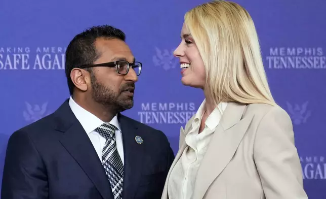 FBI Director Kash Patel and Attorney General Pam Bondi talk before President Donald Trump participates in a roundtable discussion on public safety at a Tennessee Air National Guard Base, Monday, March 23, 2026, in Memphis, Tenn. (AP Photo/Mark Schiefelbein)