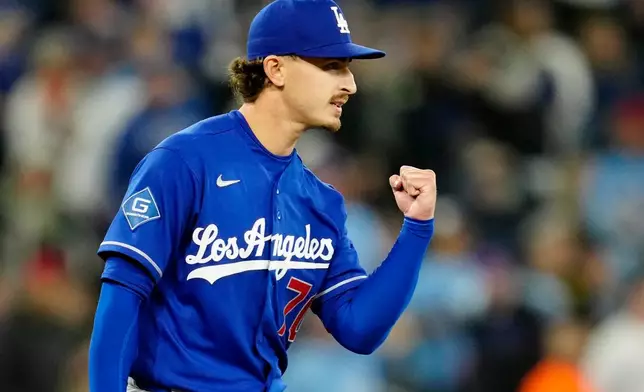 Los Angeles Dodgers pitcher Justin Wrobleski pumps his fist after a fly ball hit by Toronto Blue Jays' Vladimir Guerrero Jr. was caught during first-inning baseball game action in Toronto, Monday, April 6, 2026. (Frank Gunn/The Canadian Press via AP)