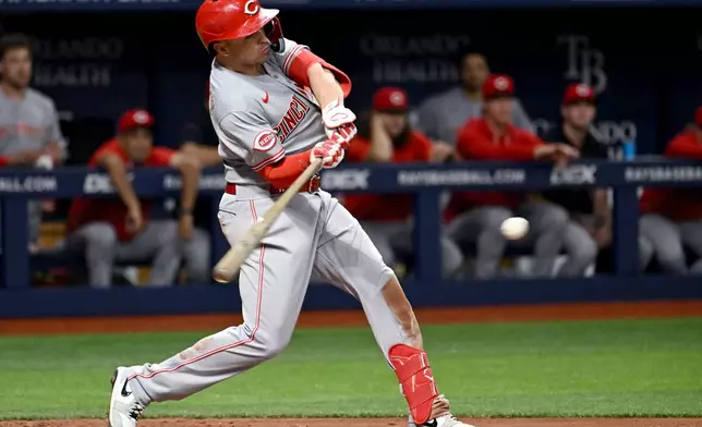 Cincinnati Reds' Sal Stewart drives in two runs with his sixth inning single during a baseball game against the Tampa Bay Rays Tuesday, April 21, 2026, in St. Petersburg, Fla. (AP Photo/Jason Behnken)