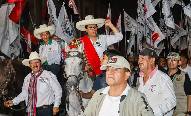 Presidential candidate Roberto Sanchez of Together for Peru party arrives to his closing campaign rally on a horse in Lima, Peru, Wednesday, April 8, 2026. (AP Photo/Bruno Elias)