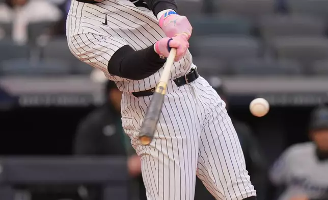 New York Yankees' Aaron Judge hits a single during the first inning of a baseball game against the Miami Marlins, Sunday, April 5, 2026, in New York. (AP Photo/Seth Wenig)