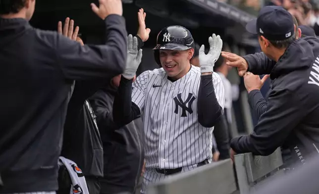 New York Yankees' Ben Rice celebrates his three-run home run in the dugout during the first inning of a baseball game against the Miami Marlins, Sunday, April 5, 2026, in New York. (AP Photo/Seth Wenig)