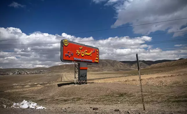 A welcome sign greets visitors on Road 16, outside the town of Bostanabad, Iran, Thursday, April 9, 2026. (AP Photo/Francisco Seco)