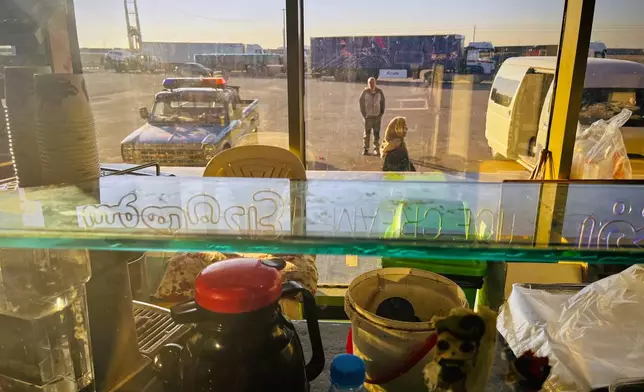 Cars and trucks line up at a gas station as seen from a roadside café on Road 2 between Tehran and Takestan, Iran, Thursday, April 9, 2026. (AP Photo/Francisco Seco)