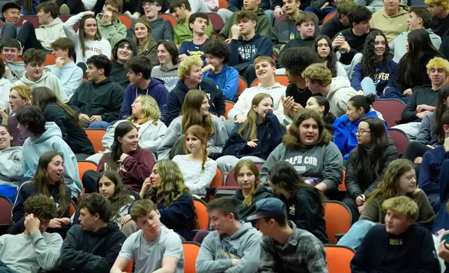Students discuss ways to prevent school shootings during a presentation of Sandy Hook Promise's "Say Something" program at Hanover High School, Wednesday, March 25, 2026, in Hanover, Mass. (AP Photo/Robert F. Bukaty)