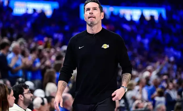 Los Angeles Lakers Head Coach JJ Redick reacts during the first half of an NBA basketball game against the Oklahoma City Thunder Thursday, April. 2, 2026, in Oklahoma City. (AP Photo/Gerald Leong)
