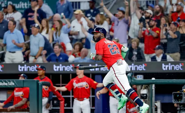 Atlanta Braves pinch hitter Michael Harris II (23) runs down the first base line after hitting a two-RBI double against the Philadelphia Phillies during the sixth inning of a baseball game, Friday, April 24, 2026, in Atlanta. (AP Photo/Erik S. Lesser)