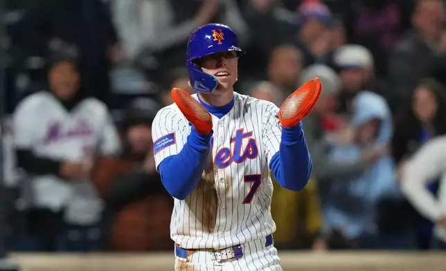 New York Mets' Brett Baty (7) celebrates after scoring on a single by Mark Vientos during the eighth inning of a baseball game against the Minnesota Twins Wednesday, April 22, 2026, in New York. (AP Photo/Frank Franklin II)