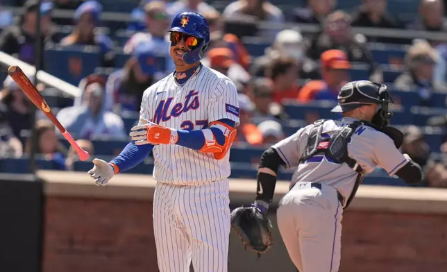 New York Mets' Mark Vientos reacts after striking out to end the sixth inning of the first baseball game of a doubleheader against the Colorado Rockies, Sunday, April 26, 2026, in New York. (AP Photo/Seth Wenig)